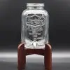 Лимонадница на тёмно-коричневой подставке.